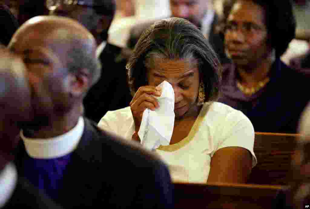 Marie Goff wipes tears from her eyes during prayer vigil held at Morris Brown AME Church, June 18, 2015 in Charleston, S.C.