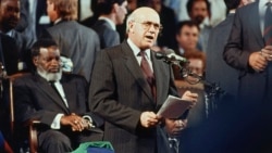 South African President F.W. de Klerk, right, marks the end of South Africa's rule of Namibia during independence celebrations, in Windhoek, Namibia, March 21, 1990. (AP Photo/John Parkin/File)