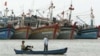 FILE - Vietnamese fishermen paddle their boat in Vung Tau, 125 kilometers (77 miles) southeast of Vietnam's Ho Chi Minh city.