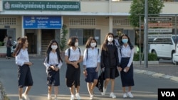 A group of students walks to school on the first day of a new academic year, in Phnom Penh Cambodia, January 11, 2021. (Tum Malis/VOA Khmer)