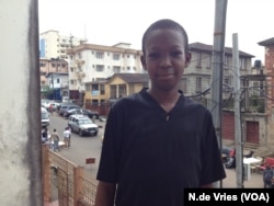 Kidney patient, Fredrick Garber, stands outside his father’s office, in Freetown, Sierra Leone, Aug. 24, 2016.