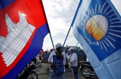 FILE - Supporters of the Cambodia National Rescue Party (CNRP) gather during a local election campaign in Phnom Penh, Cambodia May 20, 2017.