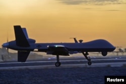 FILE - A MQ-9 Reaper drone taxis at Kandahar Airfield, Afghanistan, Dec. 27, 2009. MQ-9 Reaper drones are reportedly armed with Hellfire missiles, laser-guided bombs and other munitions.