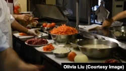 Ekber Kayser, the chef at Dolan, stands before the ingredients for Uyghur polo