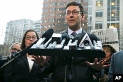 Washington Attorney General Bob Ferguson talks to reporters, Feb. 3, 2017, following a hearing in federal court in Seattle. A U.S. judge temporarily blocked President Donald Trump's travel ban after Washington state and Minnesota urged a nationwide hold on the executive order that has launched legal battles across the country.