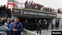 Turkish police officers stand guard at the entrance of a car park where a vehicle belongs to Saudi Arabia's consulate was found, in Istanbul, Turkey, Oct. 22, 2018.