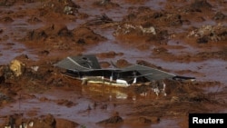 FILE - Debris of a house is pictured at Bento Rodrigues district, which was covered with mud after a dam owned by Vale SA and BHP Billiton Ltd. burst in Mariana, Brazil, Nov. 6, 2015.
