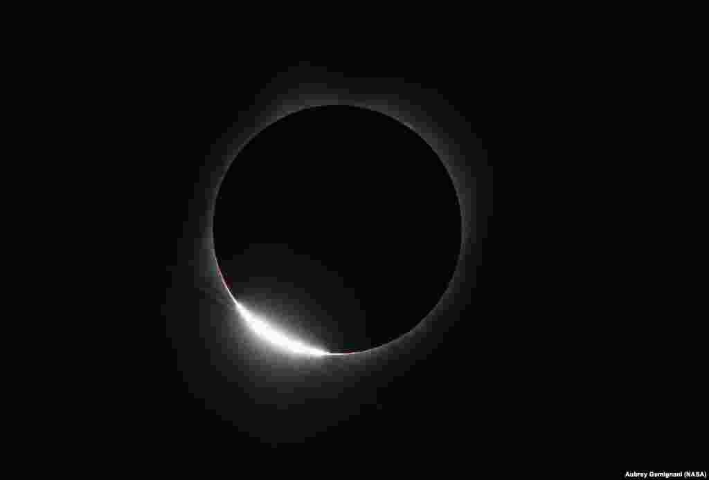 The Diamond Ring effect is seen as the moon makes its final move over the sun during the total solar eclipse above Madras, Oregon, Aug. 21, 2017.