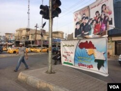 Some people in minority groups in Kirkuk say they didn't vote in the independence referendum promoted in this sign because they believed the issue to be a Kurdish one on Sept. 26, 2017 in Kirkuk. (Photo: H. Murdock / VOA)