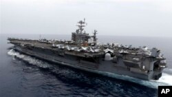 Kapal Induk Amerika USS Harry S.Truman (Foto: dok). Pentagon menangguhkan keberangkatan dua kapal perang ke Teluk Persia, USS Harry S.Truman dan USS Gettysburg karena kemungkinan pemotongan anggaran. 