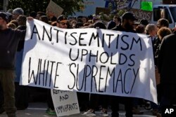 A sign during a protest gathering on the block of the Jewish Community Center in the Squirrel Hill neighborhood of Pittsburgh, where the funeral for Dr. Jerry Rabinowitz, Oct. 30, 2018.