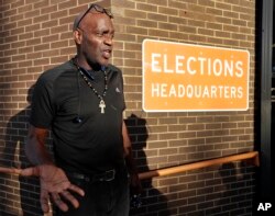 Former felon Robert Eckford talks with reporters after registering to vote at the Supervisor of Elections office, Jan. 8, 2019, in Orlando, Florida.