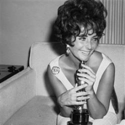 Elizabeth Taylor holds the Academy Award she won for her role in "Butterfield 8"