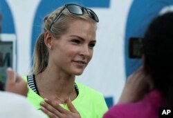 Russia's long jumper Darya Klishina speaks at the National track and field championships at a stadium in Cheboksary, Russia, June 20, 2016.