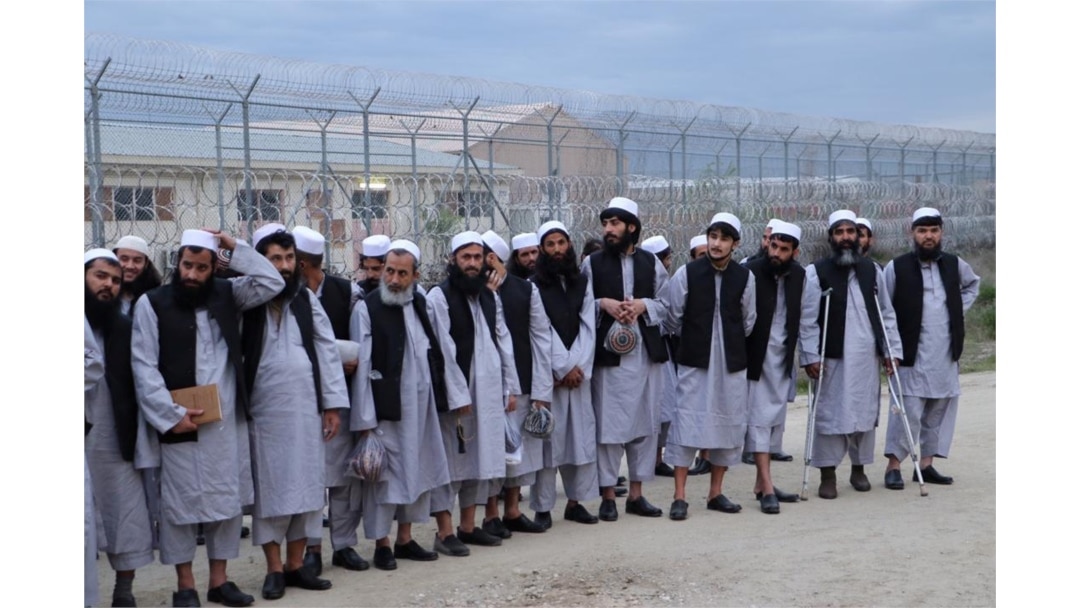 Newly freed Taliban prisoners line up at Bagram prison, north of Kabul, Afghanistan, April 11, 2020, in this photo provided by National Security Council of Afghanistan.