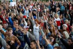 Protesters rally against elections results they say were rigged, in Independence Square in Minsk, Belarus, Aug. 27, 2020.
