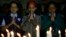 India schoolgirls offer prayers for victims killed in a Taliban attack on a Pakistan military-run school, in Mumbai, India, Dec. 17, 2014. 