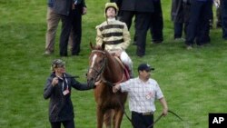 FILE - Flavien Prat on Country House reacts after the 145th running of the Kentucky Derby horse race at Churchill Downs in Louisville, Ky., May 4, 2019.