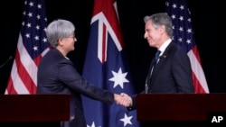 (FILE) Australia's Foreign Minister Penny Wong shakes hands with Secretary of State Antony Blinken in Annapolis, Tuesday, Aug. 6, 2024.