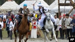 Participants take part in a horse-riding competition during the second World Nomad Games at Issyk Kul lake in Cholpon-Ata, Kyrgyzstan, Sept. 4, 2016.