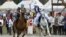 Participants take part in a horse-riding competition during the second World Nomad Games at Issyk Kul lake in Cholpon-Ata, Kyrgyzstan, Sept. 4, 2016.