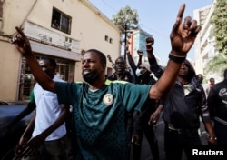 FILE - Senegalese demonstrators are pushed back by riot police, near Senegal's National Assembly in Dakar, Senegal February 5, 2024.