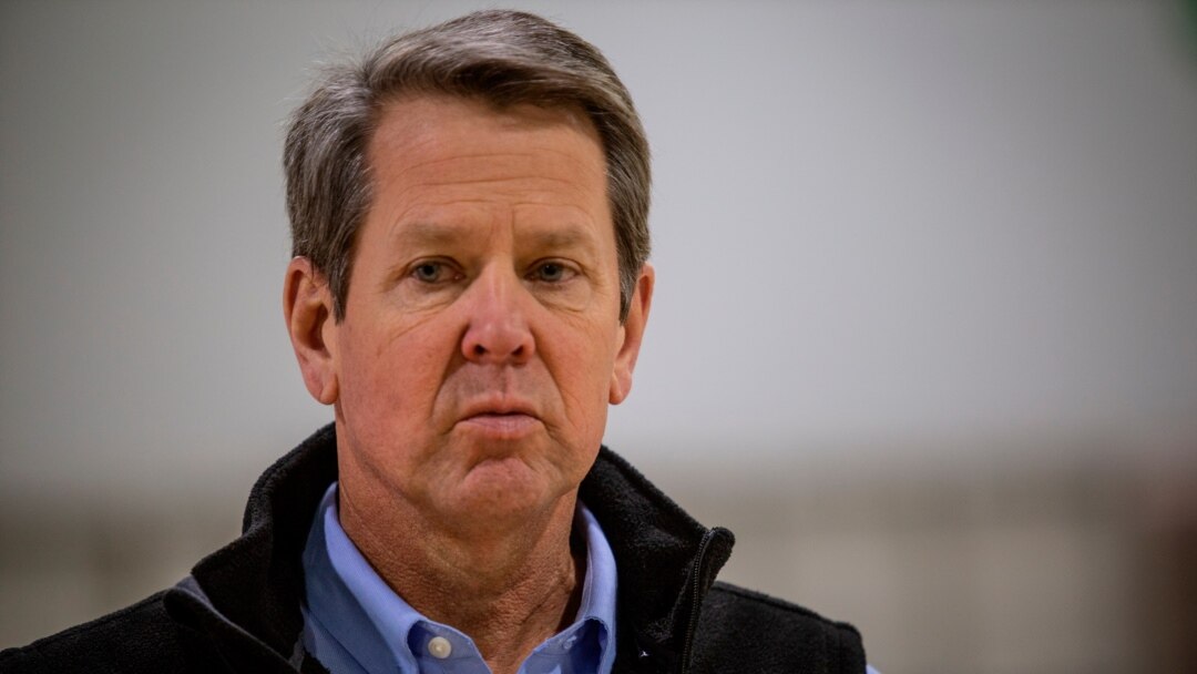 FILE - Georgia Gov. Brian Kemp listens to a reporter's question at the Georgia World Congress Center on April 16, 2020, in Atlanta.