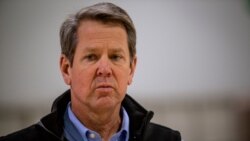 FILE - Georgia Gov. Brian Kemp listens to a reporter's question at the Georgia World Congress Center on April 16, 2020, in Atlanta.