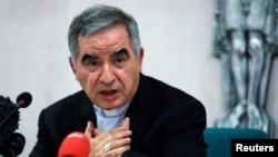 FILE - Angelo Becciu, a former adviser to Pope Francis, speaks to the media in Rome on Sept. 25, 2020. Becciu received a sentence of five years and six months in jail from a Vatican court on Dec. 16, 2023, for financial crimes.