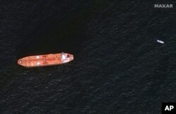 In this image provided by Maxar Technologies, the oil tanker Mercer Street is seen off the coast of Fujairah, United Arab Emirates, Aug. 4, 2021. The United States, United Kingdom and Israel blame Iran for an attack on the Mercer Street off Oman.