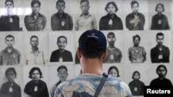 FILE-A tourist visits the Tuol Sleng Genocide Museum, also known as the notorious security prison S-21, in Phnom Penh March 3, 2015. 