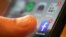 FILE - An iPhone displays the Facebook app in New Orleans, Aug. 11, 2019. 