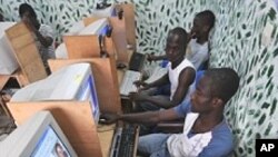 Ivorian youth checking an electoral commission website in a cyber cafe in Abidjan, Ivory Coast, on April 4, 2012.