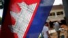 FILE: In this Saturday, July 17, 2010 photo, a Cambodian flag with a depiction of Angkor Wat in the center is hoisted near a construction site in Siem Reap, about 143 miles (230 kilometers) northwest of the capital, Phnom Penh, Cambodia.