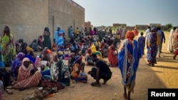 FILE - Sudanese refugees are seen gathered as Doctors Without Borders (MSF) teams assist the war-wounded from West Darfur, Sudan, in Adre, Chad, June 16, 2023. (Mohammad Ghannam/MSF/Handout via Reuters)