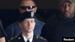U.S. Army Private First Class Bradley Manning (C) departs the courthouse at Ft. Meade, Maryland, July 30, 2013. 