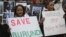 Burundi nationals from across the U.S. and Canada, along with supporters, demonstrate outside U.N. headquarters, calling for an end to political atrocities and human rights violations in Burundi, April 26, 2016.