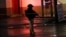 FILE - A state policeman keeps watch near a tire shop, which according to local media is the crime scene of a quadruple homicide, in Ciudad Juarez, Mexico, Dec. 6, 2017. 