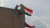 Sudanese pro-democracy supporters celebrate a final power-sharing pact with the ruling military council, Aug 17, 2019, in Khartoum. The deal paves the way for a transition to civilian-led government following the overthrow of President Omar al-Bashir.