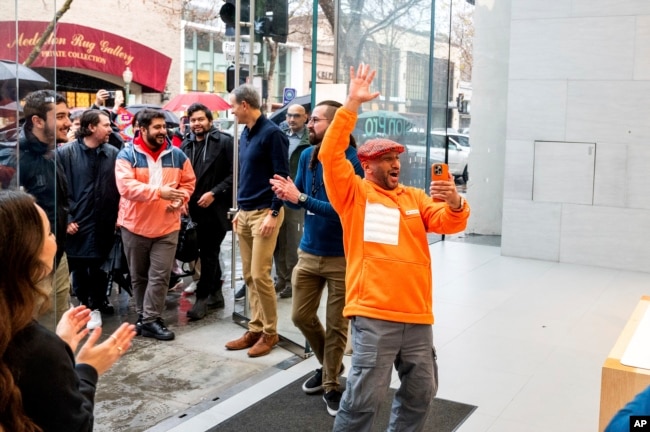 Mohamed Jawad enters a Palo Alto, Calif, Apple store to purchase a Vision Pro headset on the first day of sales on Friday, Feb. 2, 2024. (AP Photo/Noah Berger)