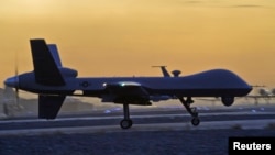 FILE - A MQ-9 Reaper drone taxis at Kandahar Airfield, Afghanistan, Dec. 27, 2009. MQ-9 Reaper drones are reportedly armed with Hellfire missiles, laser-guided bombs and other munitions.