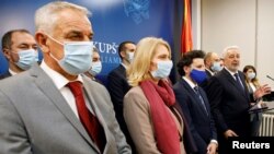 Montenegro's Prime Minister Zdravko Krivokapic with members of his cabinet adresses the media after the swearing-in ceremony at the parliament in Podgorica, Montenegro December 4, 2020. REUTERS/Stevo Vasiljevic