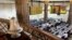 FILE - Traders work near the exchange bell at Egypt's Stock Exchange in Cairo, July 3, 2013. 