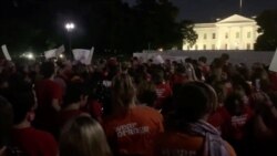 FILE - Members of Moms Demand Action for Gun Sense in America, along with student activists, demonstrate against gun violence outside the White House, after the El Paso, Texas Walmart deadly shooting, Aug. 3, 2019.