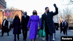 U.S. Vice President Kamala Harris and her husband Douglas Emhoff walk during the Inauguration Day parade for U.S. President Joe Biden, in Washington, January 20, 2021. 