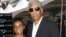 FILE - Actor Morgan Freeman and his step-granddaughter E'Dena Hines attend the world premiere of "The Dark Knight" at AMC Loews Lincoln Square in New York, July 14, 2008.