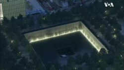 纽约9/11纪念园黎明时点亮灯光