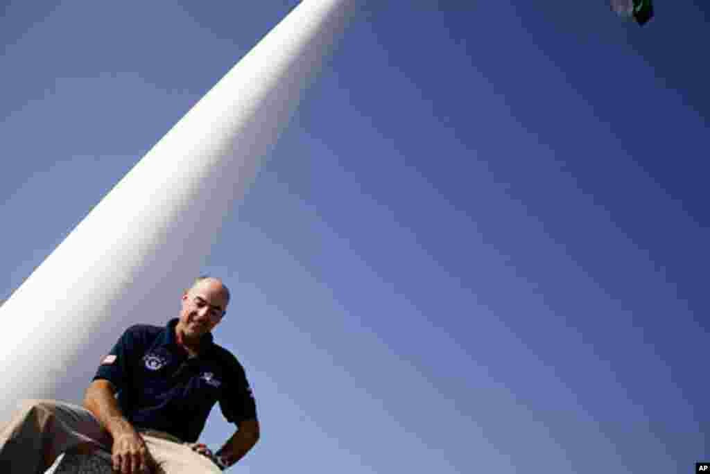 David Chambers, owner of Trident Support which builds flagpoles worldwide, sits by the world's tallest flagpole in Dushanbe, Tajikistan, September 29, 2011. –VOA Photo Y. Weeks