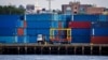 FILE - Shipping containers are stacked on a pier at the Red Hook Terminal in Brooklyn, New York, Sept. 20, 2024.