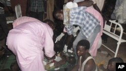 People injured in a suicide bomb attack are treated at the General hospital in Potiskum, Nigeria, Nov. 3, 2014.